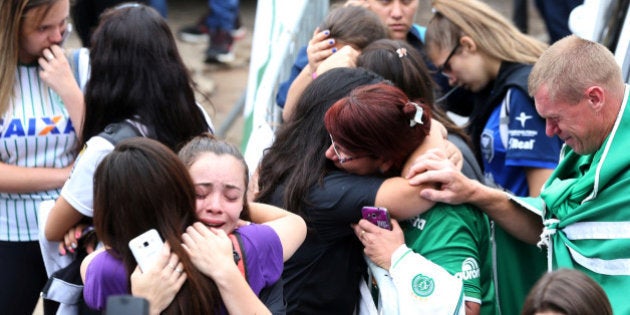 Fans of Chapecoense soccer team react in front of the Arena Conda stadium in Chapeco, Brazil, November 29, 2016. REUTERS/Paulo Whitaker