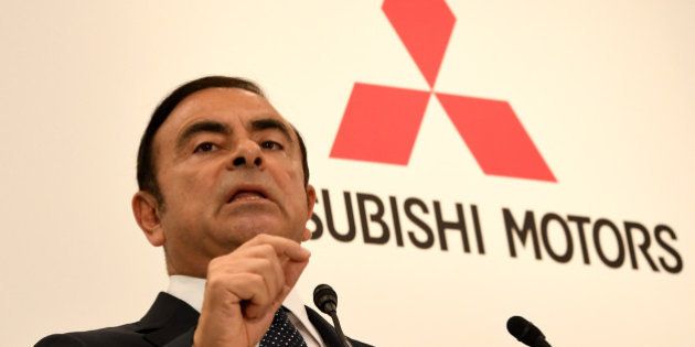 Nissan Motors chairman and CEO Carlos Ghosn answers a question during a joint press conference with Mitsubishi Motors Corporation (MMC) president and CEO Osamu Masuko in Tokyo on October 20, 2016.Ghosn, the head of Japan's number two automaker Nissan, said on October 20 will become chairman of struggling Mitsubishi Motors, five months after throwing a lifeline to the scandal-hit firm. / AFP / TOSHIFUMI KITAMURA (Photo credit should read TOSHIFUMI KITAMURA/AFP/Getty Images)