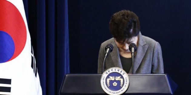 South Korean President Park Geun-hye bows during her address to the nation at the presidential Blue House in Seoul, Tuesday, Nov. 29, 2016. The embattled South Korean president says she'll resign if parliament comes up with a plan for the safe transfer of power. (Pool Photo via AP)