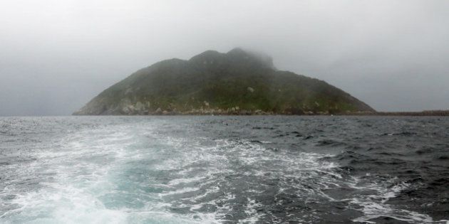 This September 30, 2016 picture shows a view of Okinoshima island, some 60 kilometres from Munakata city, Fukuoka prefecture.The island of Okinoshima and associted sites in the Munakata Region have been inscribed at the 41st session of the UNESCO World Heritage Committee held in Poland on July 9, 2017. / AFP PHOTO / JIJI PRESS / STR / Japan OUT (Photo credit should read STR/AFP/Getty Images)