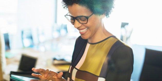 Businesswoman using digital tablet in meeting