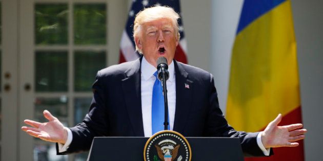 U.S. President Donald Trump reacts to a reporter's question during a joint news conference with Romanian President Klaus Iohannis in the Rose Garden at the White House in Washington, U.S. June 9, 2017. REUTERS/Jonathan Ernst