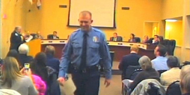 FILE - In this Feb. 11, 2014 file image from video provided by the City of Ferguson, Mo., officer Darren Wilson attends a city council meeting in Ferguson. Police identified Wilson, 28, as the police officer who shot 18-year-old Michael Brown on Aug. 9, 2014 in Ferguson, Mo. (AP Photo/City of Ferguson, File)