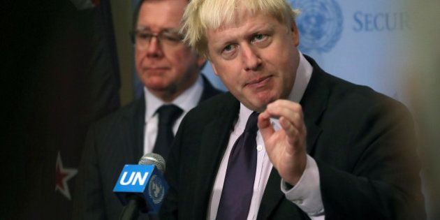 New Zealand's Foreign Minister Murray McCully and Britain's Foreign Secretary Boris Johnson participate in a press briefing after the U.N. Security Council voted on a resolution on