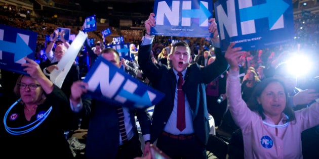 Supporters cheer as Democratic presidential candidate Hillary Clinton speaks at the New Hampshire Democratic Party McIntyre-Shaheen 100 Club Celebration dinner Friday, Feb. 5, 2016, in Manchester, N.H. (AP Photo/Matt Rourke)