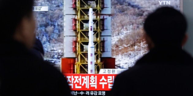 People watch a TV news reporting a rocket launch in North Korea, at Seoul Railway Station in Seoul, Sunday, Feb. 7, 2016. For North Korea's propaganda machine, the long-range rocket launch Sunday carved a glorious trail of