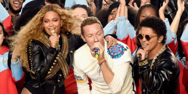 SANTA CLARA, CA - FEBRUARY 07: (L-R) Beyonce, Chris Martin of Coldplay and Bruno Mars perform onstage during the Pepsi Super Bowl 50 Halftime Show at Levi's Stadium on February 7, 2016 in Santa Clara, California. (Photo by Kevin Mazur/WireImage)