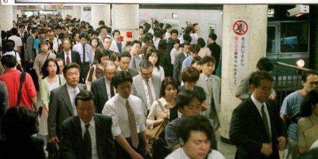 Japanese commuters pack a platform of the Chiyoda-line, one of Tokyo's most popular subway lines, during rush hour at Hibiya station in downtown Tokyo, June 17, 1999. It has been more than a decade since the Tokyo Metropolitan Transport Bureau proposed a new line that would run a 29-kilometer (18-mile) loop around the city. The project's construction is now years behind schedule and cost overruns are measured in the hundreds of billions of yen (billions of dollars),so high that they will take four decades to pay off. (APPhoto/Katsumi Kasahara)