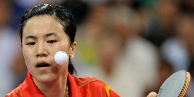 Wang Nan of China plays a shot during her women's team table tennis final match against Feng Tianwei of Singapore at the Beijing 2008 OIympic Games August 17, 2008. REUTERS/Joe Chan (CHINA)
