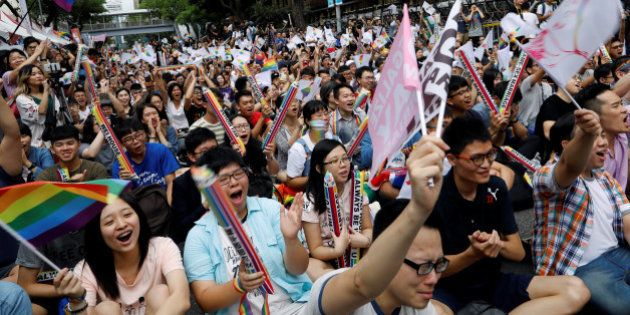 Supporters react during a rally after Taiwan's constitutional court ruled that same-sex couples have the right to legally marry, the first such ruling in Asia, in Taipei, Taiwan May 24, 2017. REUTERS/Tyrone Siu