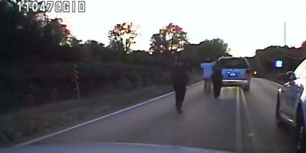 In this image made from a Friday, Sept. 16, 2016 police video, Terence Crutcher, center, is pursued by police officers as he walk to an SUV in Tulsa, Okla. Crutcher was taken to the hospital where he was pronounced dead after he was shot by the officer around 8 p.m., Friday, police said. Crutcher had no weapon on him or in his SUV, Tulsa Police Chief Chuck Jordan said Monday, Sept. 19, 2016. (Tulsa Police Department via AP)