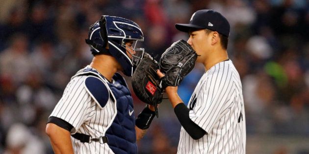 Jun 6, 2017; Bronx, NY, USA; New York Yankees starting pitcher Masahiro Tanaka (19) talks with Yankees catcher Gary Sanchez (24) during the fourth inning against the Boston Red Sox at Yankee Stadium. Mandatory Credit: Adam Hunger-USA TODAY Sports