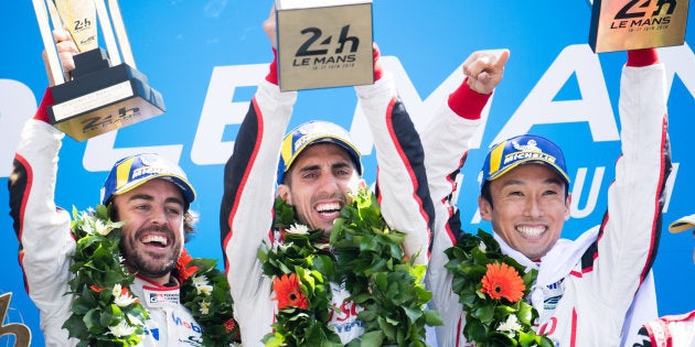 LE MANS, FRANCE - JUNE 17: Race winners - the #08 Toyota Gazoo Racing TS050 Hybrid of Fernando Alonso of Spain, Sebastien Buemi of Switzerland, and Kazuki Nakajima of Japan, celebrate on the podium at the Le Mans 24 Hour race on June 17, 2018 in Le Mans, France. (Photo by James Moy Photography/Getty Images)