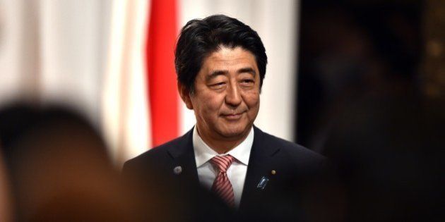 Japanese Prime Minister Shinzo Abe smiles after he delivered a speech at the 50th anniversary ceremony for the normalizing relations between Japan and South Korea, hosted by the South Korean embassy in Tokyo on June 22, 2015. South Korean Foreign Minister Yun Byung-Se is here to attend the ceremony. AFP PHOTO / POOL / Yoshikazu TSUNO (Photo credit should read YOSHIKAZU TSUNO/AFP/Getty Images)