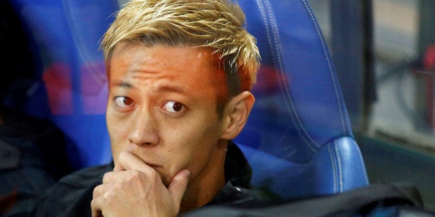 Football Soccer - Japan v Saudi Arabia - World Cup 2018 Qualifier - Saitama Stadium 2002, Saitama, Japan - 15/11/16. Japan's Keisuke Honda is seen in the bench seat before the match. REUTERS/Toru Hanai