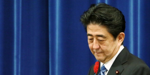 Shinzo Abe, Japan's prime minister, arrives for a news conference at the prime minister's official residence in Tokyo, Japan, on Tuesday, Oct. 1, 2013. Abe proceeded with an April sales-tax increase and will implement a stimulus program as he tries to rein in the world's biggest debt burden without jeopardizing efforts to end deflation. Photographer: Haruyoshi Yamaguchi/Bloomberg via Getty Images