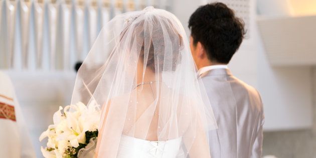 Happy bride and groom walking on virgin load