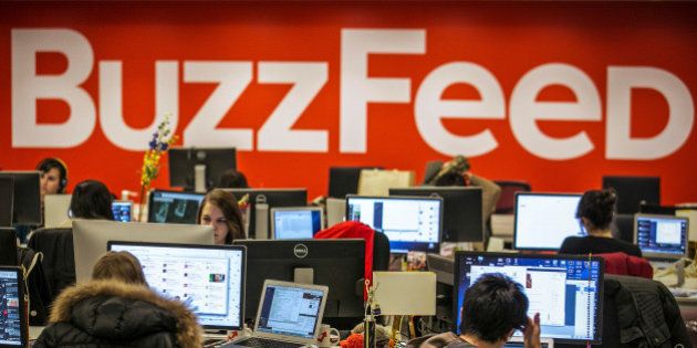 Buzzfeed employees work at the company's headquarters in New York January 9, 2014. REUTERS/Brendan McDermid/File Photo