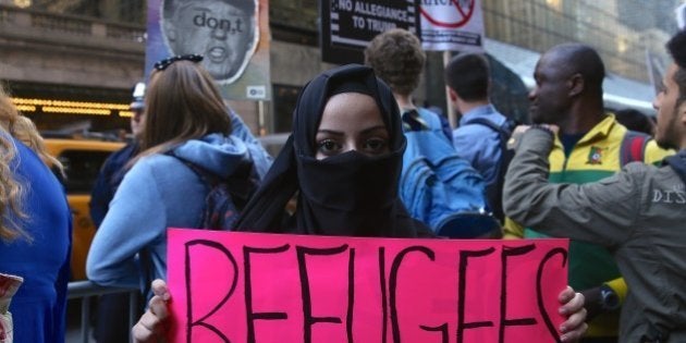 NEW YORK, USA - APRIL 14: Protesters gather outside of the Grand Hyatt Hotel during a demonstration against US Republican presidential candidate Donald Trump and his racist, Islamophobic hate speech in New York, NY, United States on April 14, 2016. US Republican presidential candidate Donald Trump wants 'total and complete shutdown of Muslims entering the United States' as well as he said 'All Muslim immigration to the United States should be halted'. (Photo by Cem Ozdel/Anadolu Agency/Getty Images)