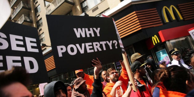 NEW YORK, NY - APRIL 15: Low wage workers, many in the fast-food industry, join with supporters in front of a McDonald's to demand a minimum wage of $15 an hour on April 15, 2015 in New York City. In what organizers are calling the biggest ever mobilization of workers in the U.S., thousands of people took to the streets across the country to stage protests in front of businesses that are paying some of their workers the minimum wage. Home care workers, and employees at Walmart and fast food restaurants say that the current minimum is not a living wage. (Photo by Spencer Platt/Getty Images)