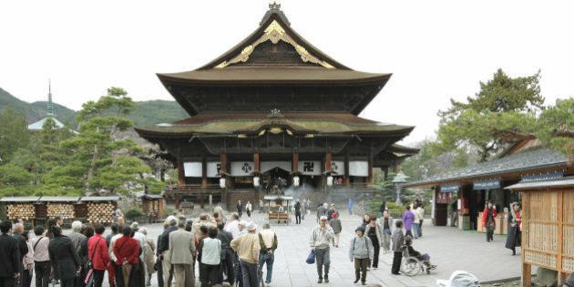 People visit Japan's Buddhist Zenkoji temple in Nagano, central Japan on April 18, 2008. The Zenkoji temple has pulled out of plans to host a ceremony for the Olympic torch relay because of China's crackdown in Tibet. AFP PHOTO/JIJI PRESS (Photo credit should read STR/AFP/Getty Images)