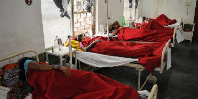 Indian women who underwent sterilization surgeries receive treatment at the District Hospital in Bilaspur, in the central Indian state of Chhattisgarh, Wednesday, Nov. 12, 2014, after at least a dozen died and many others fell ill following similar surgery. The surgeon who performed the operations at the government-run