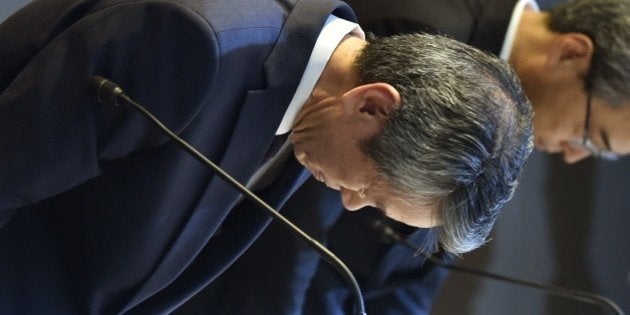 President of Toshiba, Hisao Tanaka (L) bows at the end of a press conference at the company's headquarters in Tokyo on July 21, 2015. Toshiba president Hisao Tanaka and his predecessor Norio Sasaki quit the company on July 21 as one of Japan's best-known firms was hammered by a 1.2 billion USD accounting scandal blamed on management's overzealous pursuit of profit. AFP PHOTO / KAZUHIRO NOGI (Photo credit should read KAZUHIRO NOGI/AFP/Getty Images)