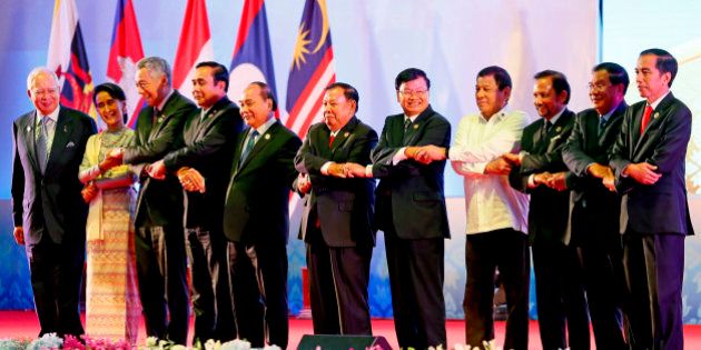 Southeast Asian leaders link arms at the opening of the 28th and 29th ASEAN Summits and other related summits in the National Convention Center Tuesday, Sept. 6, 2016 in Vientiane, Laos. From left to right; Malaysia's Prime Minister Najib Razak, Myanmar's Foreign Minister Aung San Suu Kyi, Singapore's Prime Minister Lee Hsien Loong, Thailand's Prime Minister Prayuth Chan-ocha, Vietnam's President Tran Dai Quang, Laos' President Bounnhang Vorachith, Laos' Prime Minister Thongloun Sisoulith, Philippines' President Rodrigo Duterte, Brunei's Sultan Hassanal Bolkiah, Cambodia's Prime Minister Hun Sen and Indonesia's President Joko Widodo. (AP Photo/Bullit Marquez)