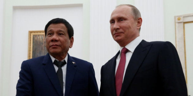 Russian President Vladimir Putin shakes hands with Philippine President Rodrigo Duterte during their meeting at the Kremlin in Moscow, Russia, May 23, 2017. REUTERS/Maxim Shemetov