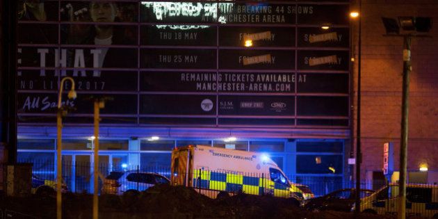 A police van and an ambulance are seen outside the Manchester Arena, where U.S. singer Ariana Grande...