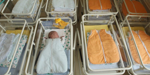 UNDISCLOSED, GERMANY - AUGUST 12: A 4-day-old newborn baby, who has been placed among empty baby beds by the photographer, lies in a baby bed in the maternity ward of a hospital (a spokesperson for the hospital asked that the hospital not be named) on August 12, 2011 in a city in the east German state of Brandenburg, Germany. According to data released by Eurostat last week Germany, with 8.3 births per 1,000 people, has the lowest birth rate in all of Europe. Eastern Germany, which not only suffers from a low birth rate, also has a declining population due to young people moving away because of high unemployment in the region. Europe as a whole suffers from a low birth rate and a growing elderly population. (Photo by Sean Gallup/Getty Images)