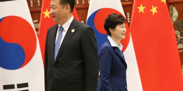 South Korean President Park Geun-hye, right, walks past Chinese President Xi Jinping during their meeting on the sidelines of the G-20 economic summit at the West Lake State Guest House in Hangzhou, China Monday, Sept. 5, 2016. (How Hwee Young/Pool Photo via AP)