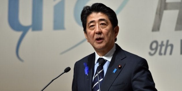 Japanese Prime Minister Shinzo Abe delivers a speech at the UIC 9th World Congress on High Speed Rail in Tokyo on July 7, 2015. Some 1,000 participants from 40 national railway companies have gathered to discuss the latest technology on the high speed railway networks at the four-day conference. AFP PHOTO / Yoshikazu TSUNO (Photo credit should read YOSHIKAZU TSUNO/AFP/Getty Images)