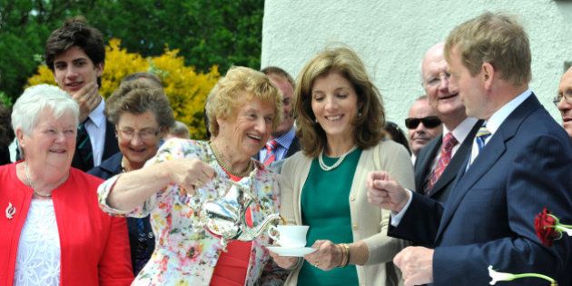 NEW ROSS, IRELAND - JUNE 22: Anna Rowe, Caroline Kennedy and Enda Kenny recreate the tea party of John F. Kennedy's visit to his ancestral homestead as part of commemorations for the 50th anniversary of the visit by US President John F Kennedy, on June 22, 2013 in New Ross, Ireland. The Eternal Flame from Kennedy's grave was used to light a flame on the quayside where he gave a speech in 1963. (Photo by Clodagh Kilcoyne/Getty Images)