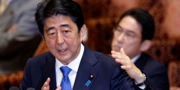 Japanese Prime Minister Shinzo Abe speaks during a parliament committee session regarding controversial bills on Japan's defense role overseas at the parliament in Tokyo, Wednesday, July 15, 2015. (AP Photo/Shuji Kajiyama)