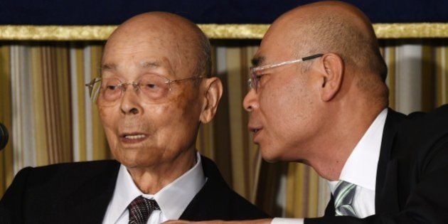 Top Japanese sushi chef Jiro Ono (L) listens to his son, Yoshikazu Ono (R), while attending a press conference at the Foreign Correspondents' Club (FCC) in Tokyo on November 4, 2014. The 84-year-old senior Ono, who has reputedly wowed US President Barack Obama to call him the best in the world, warns of a sea change in materials for the food due to overfishing, especially of tuna. AFP PHOTO / TOSHIFUMI KITAMURA (Photo credit should read TOSHIFUMI KITAMURA/AFP/Getty Images)