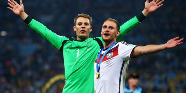 RIO DE JANEIRO, BRAZIL - JULY 13: Manuel Neuer and Benedikt Hoewedes of Germany celebrate after defeating Argentina 1-0 in extra time during the 2014 FIFA World Cup Brazil Final match between Germany and Argentina at Maracana on July 13, 2014 in Rio de Janeiro, Brazil. (Photo by Julian Finney/Getty Images)