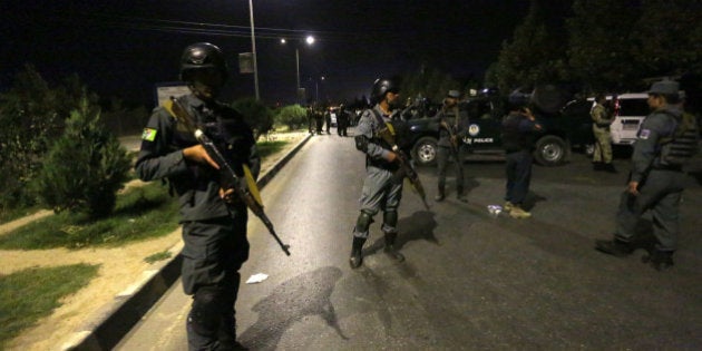 Afghan security forces respond to a complex Taliban attack on the campus of the American University in the Afghan capital Kabul on Wednesday, Aug. 24, 2016. University President Mark English told The Associated Press that security forces had arrived on the scene soon after the attack began around 7 p.m. (1430 GMT) (AP Photo/Rahmat Gul)