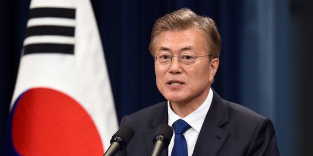 South Korea's new President Moon Jae-In speaks during a press conference at the presidential Blue House in Seoul on May 10, 2017. Moon was sworn in just a day after a landslide election victory, and immediately declared his willingness to visit Pyongyang amid high tensions with the nuclear-armed North. / AFP PHOTO / POOL / JUNG YEON-JE (Photo credit should read JUNG YEON-JE/AFP/Getty Images)