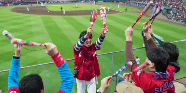 Fans celebrating at baseball match of Hiroshima Toyo Carps inside MAZDA Zoom-Zoom Stadium, Hiroshima, Hiroshima Prefecture, Japan