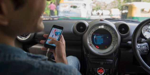 In this Friday, July 22, 2016 photo, Shivanu Mandal plays Pokemon inside a car in New Delhi, India.