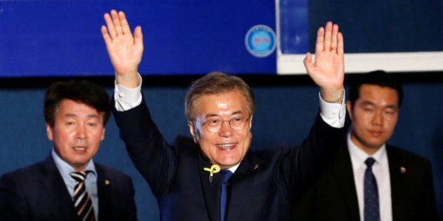 South Korea's president-elect Moon Jae-in gestures to supporters at Gwanghwamun Square in Seoul, South Korea, May 9, 2017. REUTERS/Kim Kyunghoon
