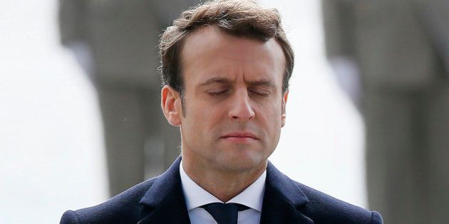 President-elect Emmanuel Macron (L) closes his eyes during a ceremony marking the 72nd anniversary of the victory over Nazi Germany during World War II on May 8, 2017 in Paris. / AFP PHOTO / POOL / Francois Mori (Photo credit should read FRANCOIS MORI/AFP/Getty Images)