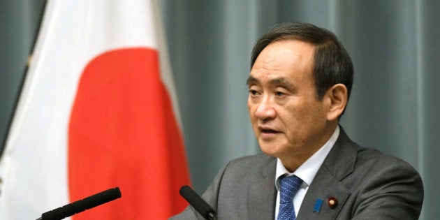 Japan's Chief Cabinet Secretary Yoshihide Suga speaks to media during a news conference after the reports on the launch of a North Korean missile, at the prime minister's office in Tokyo, Japan, in this photo taken by Kyodo February 12, 2017. Mandatory credit Kyodo/via REUTERS ATTENTION EDITORS - THIS IMAGE WAS PROVIDED BY A THIRD PARTY. EDITORIAL USE ONLY. MANDATORY CREDIT. JAPAN OUT. NO COMMERCIAL OR EDITORIAL SALES IN JAPAN. TPX IMAGES OF THE DAY