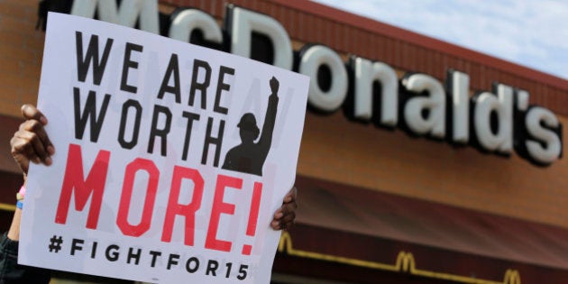 McDonald's workers and supporters rally outside a McDonald's, Wednesday, April 15, 2015, in Chicago. Fast-food workers calling for $15 an hour are picking up some more allies Wednesday. Airport workers, home care workers, Walmart workers and adjunct professors are among those set to join in the fight for $15 protests across the country, in what organizers are calling the biggest ever mobilization of workers in the U.S. (AP Photo/M. Spencer Green)