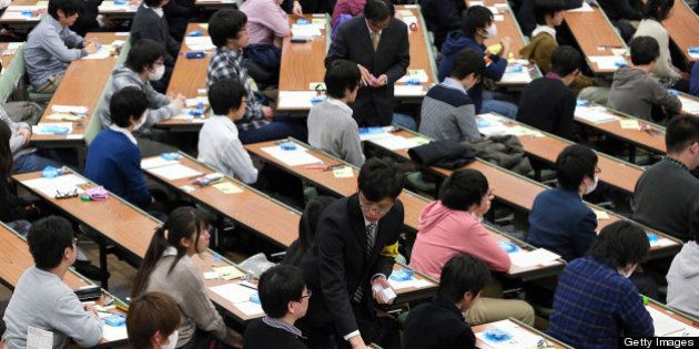 NAGOYA, JAPAN - JANUARY 19: (CHINA OUT, SOUTH KOREA OUT) High school students attend the National Center Test at Nagoya University on January 19, 2013 in Nagoya, Aichi, Japan. 573,344 who wish to enter universities and colleges applied for the test. (Photo by The Asahi Shimbun via Getty Images)