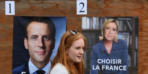 A member of the French expatriate community arrives to vote at an international school polling station set up for the French Presidential elections, in Los Angeles, California on May 6, 2017. / AFP PHOTO / Mark RALSTON (Photo credit should read MARK RALSTON/AFP/Getty Images)