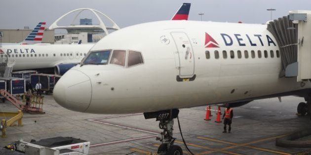 A passengers waits for a Delta Airlines flight in Terminal 5 at Los Angeles International Airport, May 4, 2017 in Los Angeles, California.In yet another incident that could prove a public relations nightmare for the airline industry, a California couple has come forward claiming they were kicked off an overbooked Delta flight for refusing to give up their child's seat. The incident unfolded last week as the Schear family of Huntington Beach were flying back home from Hawaii to Los Angeles. / AFP PHOTO / Robyn Beck (Photo credit should read ROBYN BECK/AFP/Getty Images)