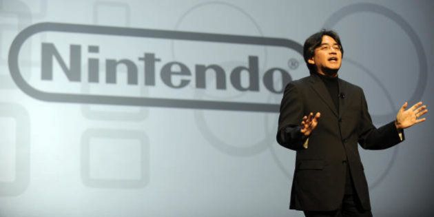 Satoru Iwata, President of Nintendo, delivers a speech during the Nintendo E3 media briefing at the Kodak Theater in Hollywood, California, on July 15, 2008. AFP PHOTO GABRIEL BOUYS (Photo credit should read GABRIEL BOUYS/AFP/Getty Images)