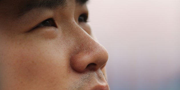 KANSAS CITY, MO - JUNE 8: Masahiro Tanaka #19 of the New York Yankees ponders a reporter's question as he talks members of the media during batting practice prior to a game to Kansas City Royals at Kauffman Stadium on June 8, 2014 in Kansas City, Missouri. (Photo by Ed Zurga/Getty Images)